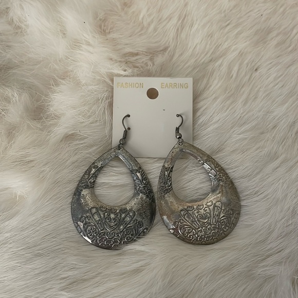 Silver Tone Oval Shaped Textured Pierced Earrings - Picture 1 of 4